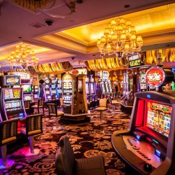 Interior of a casino featuring slot machines and game tables