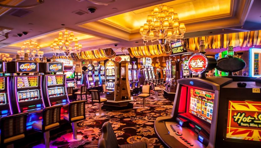 Interior of a casino featuring slot machines and game tables